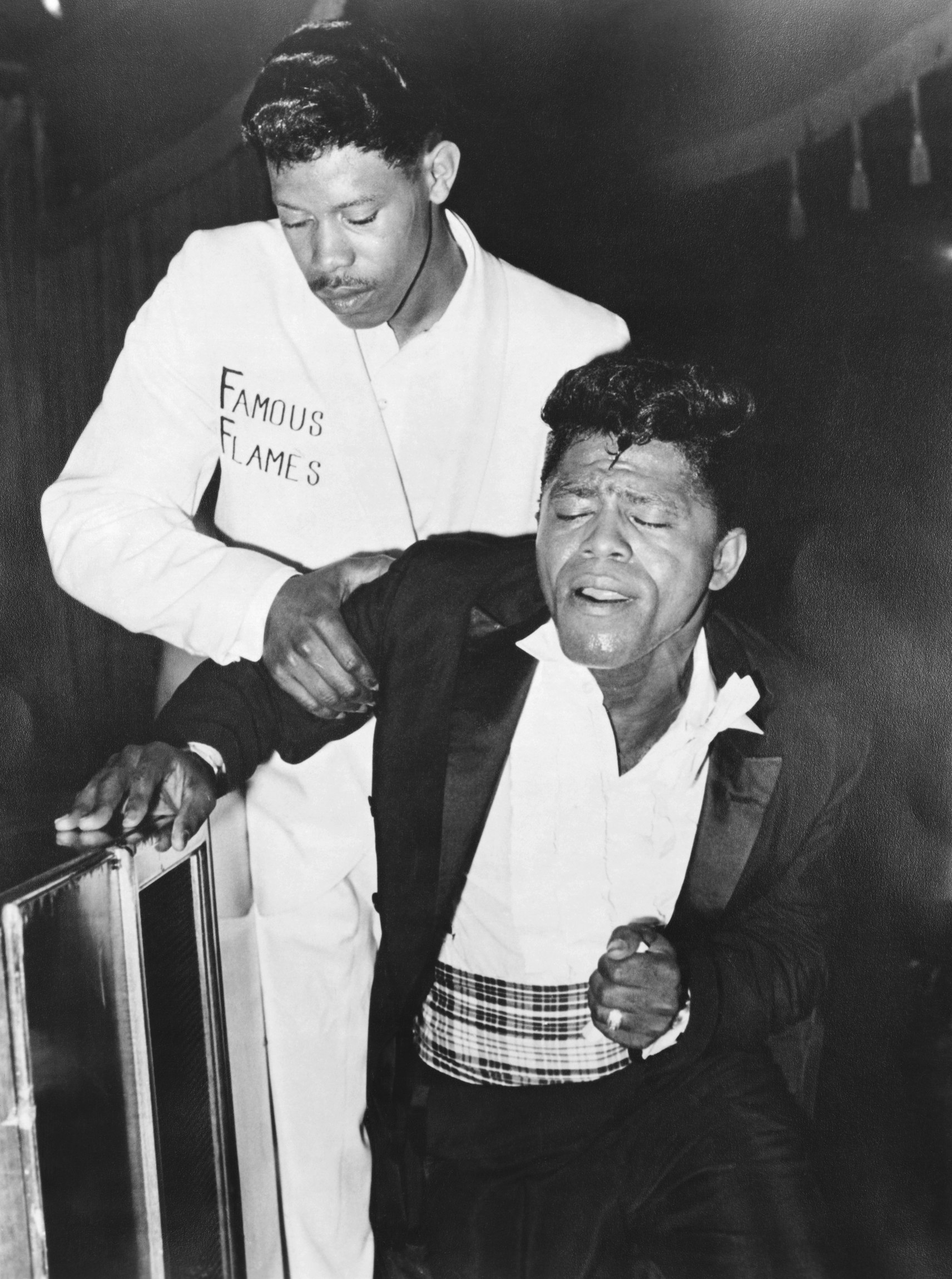 James Brown needs help! Thankfully, his trusty MC, Danny Ray, is there to hold him up, as always. Photo taken in New York City, 1963, via Michael Ochs Archives/Getty Images